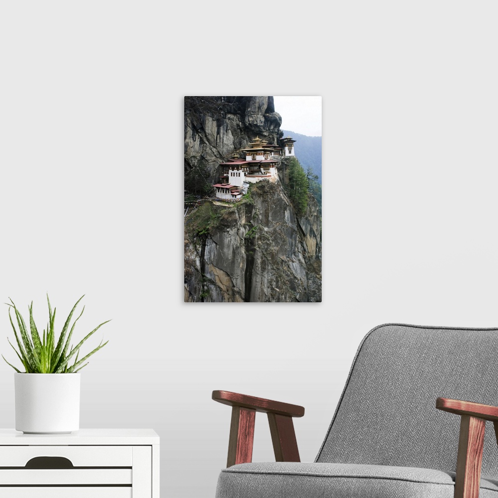 A modern room featuring Taktsang Lhakhang, known as The Tiger's Nest, is a monastery clinging to a vertical granite cliff...