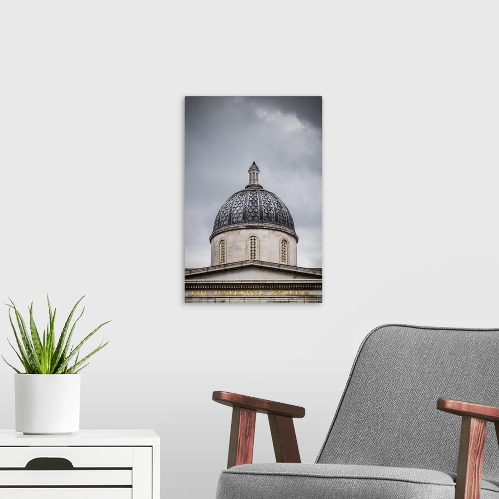 A modern room featuring The Dome Of The National Gallery Against A Stormy London Sky; London, England