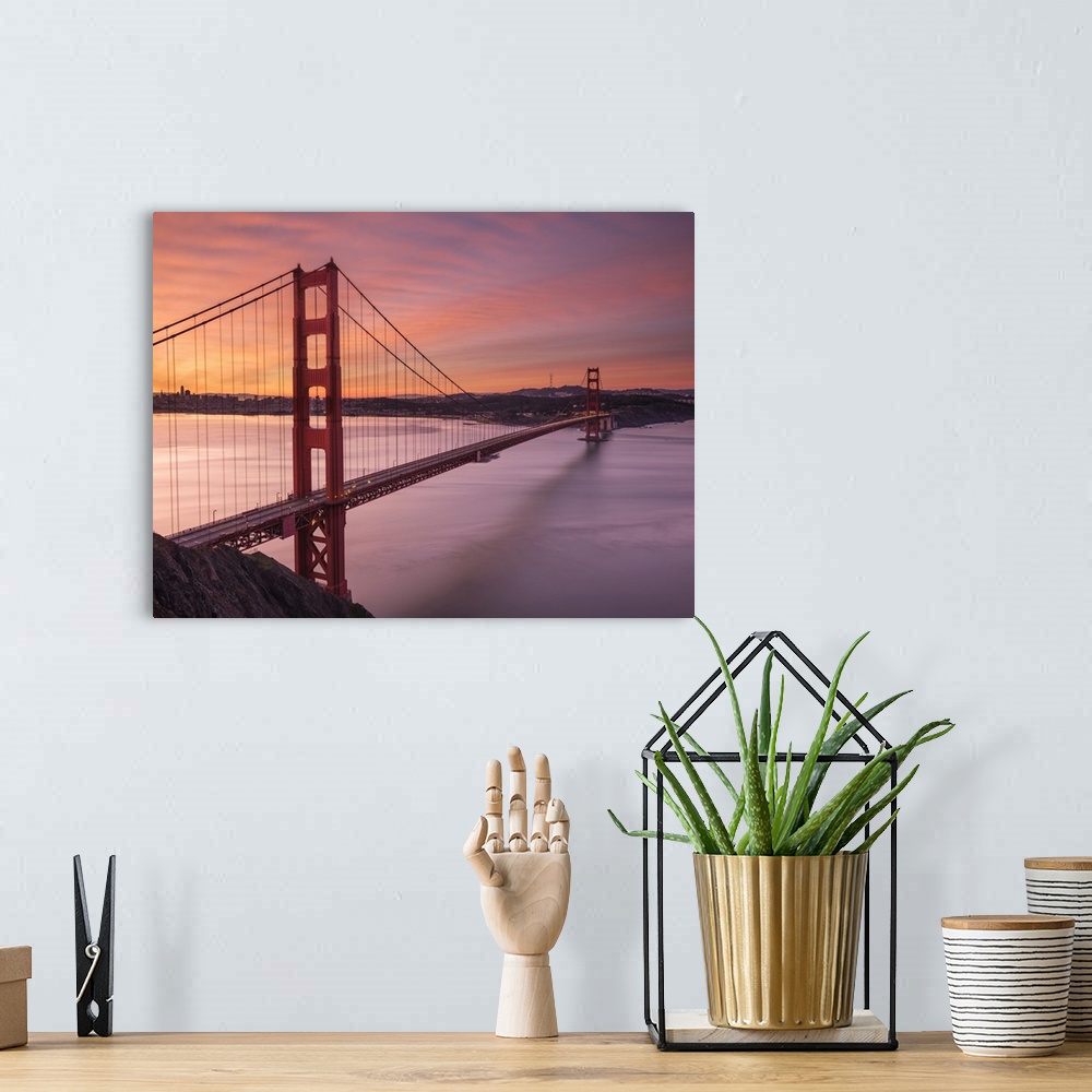 A bohemian room featuring The Golden Gate Bridge in San Francisco at sunrise.