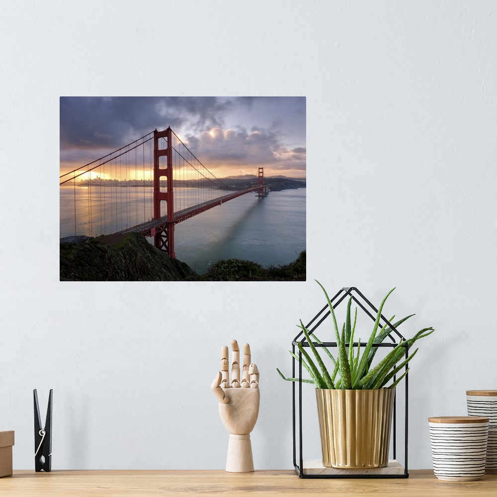 A bohemian room featuring The Golden Gate Bridge in San Francisco at sunrise.