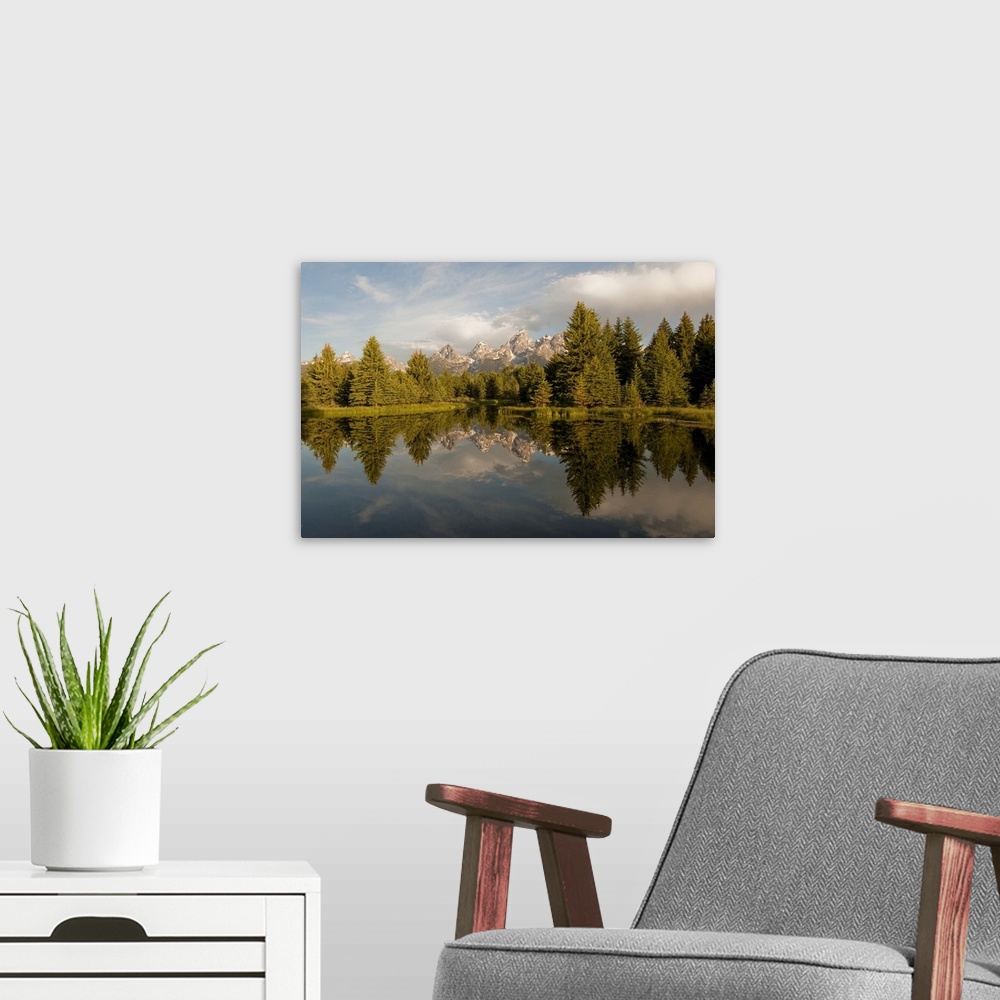 A modern room featuring The Grand Tetons reflected in Snake River in Grand Teton National Park Wyoming, United States of ...
