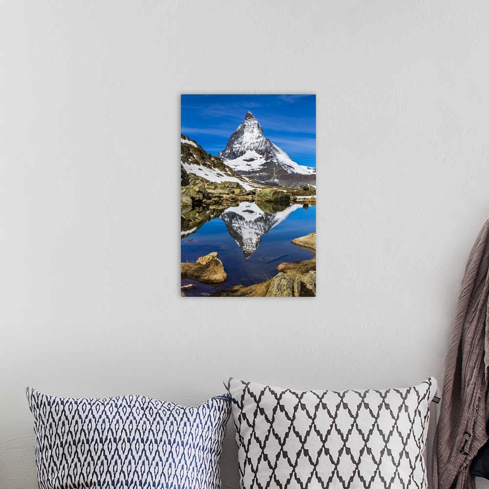 A bohemian room featuring The Matterhorn reflected in a lake near Riffelsee at Zermatt, Switzerland
