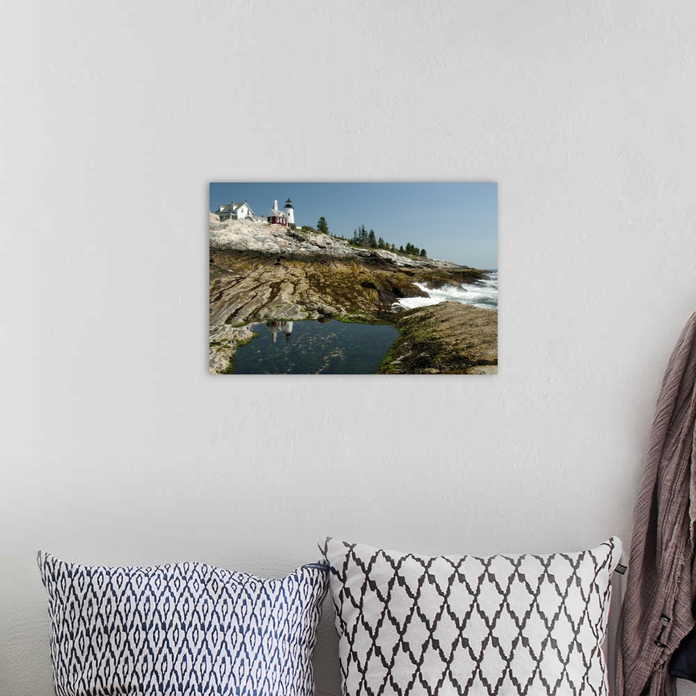 A bohemian room featuring The Pemaquid lighthouse and its reflection in a coastal tidal pool, Pemaquid Point, Maine.