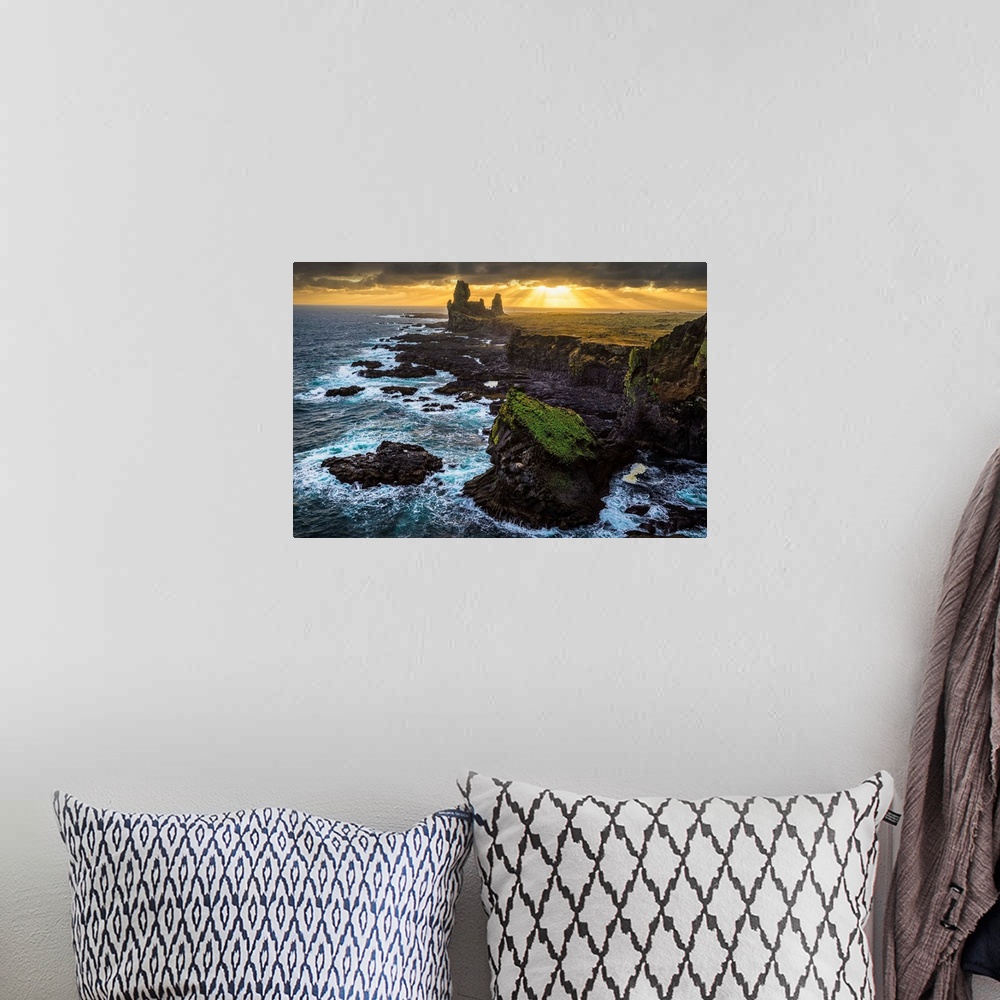 A bohemian room featuring The sea stack known as Londranger rises above the landscape, Snaefellsnes Peninsula; Iceland