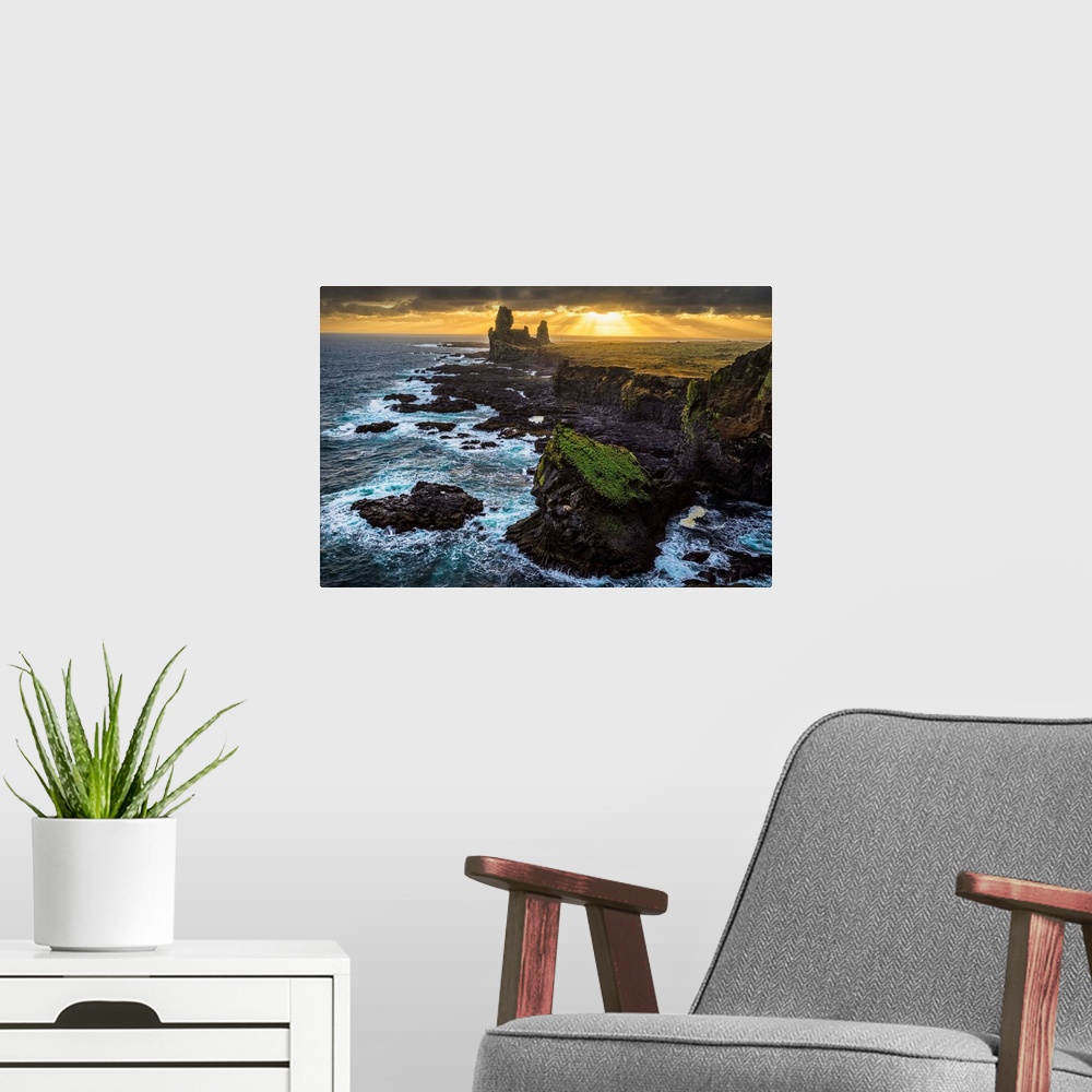 A modern room featuring The sea stack known as Londranger rises above the landscape, Snaefellsnes Peninsula; Iceland