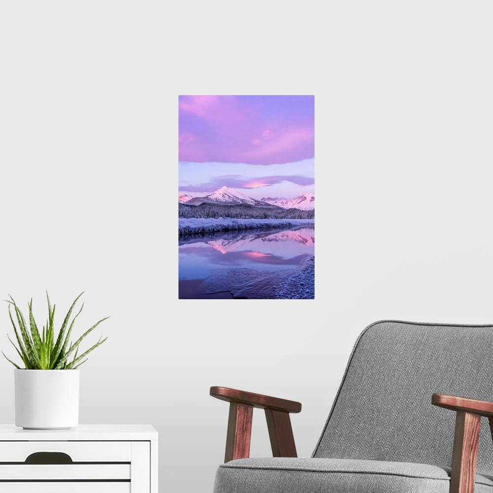 A modern room featuring Alpenglow colours the snow-covered coastal range mountains, Mendenhall Glacier and Mendenhall tow...