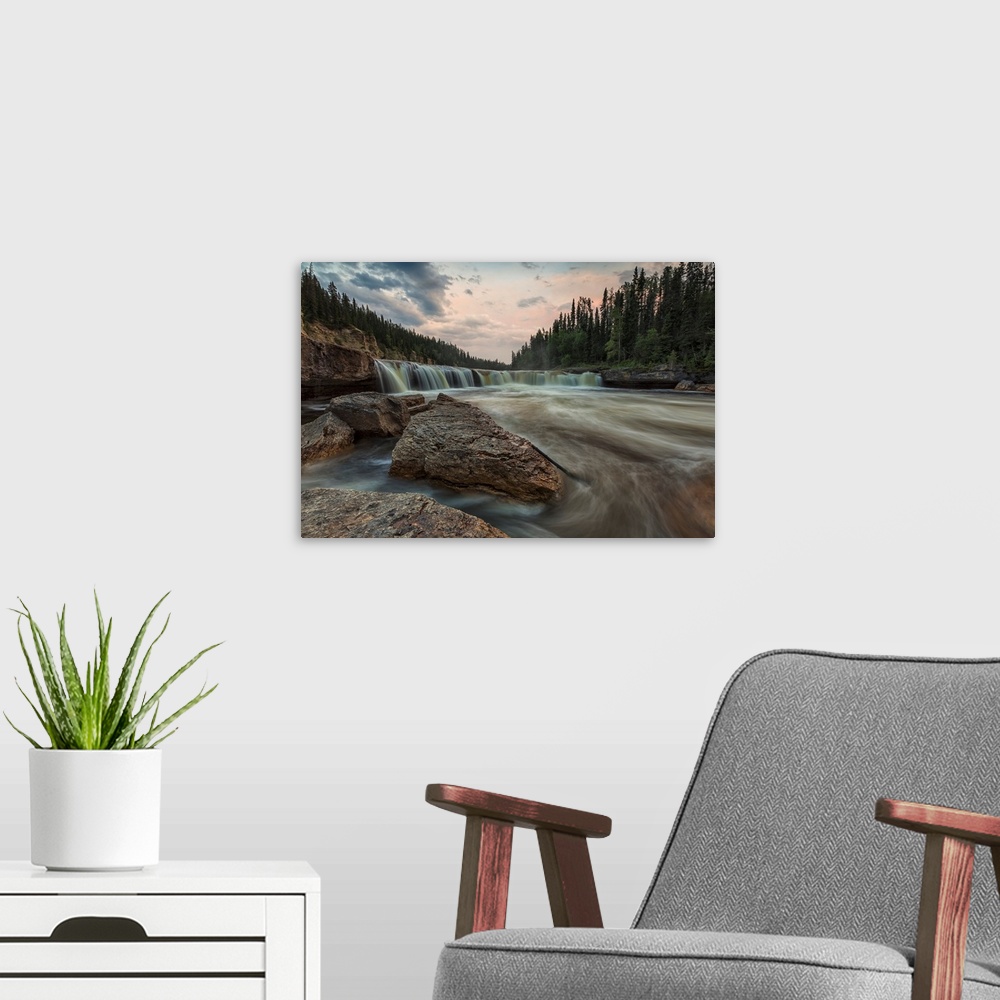A modern room featuring The Trout River Flows Over Sambaa Deh Falls In Sambaa Deh Territorial Park, Northwest Territories...