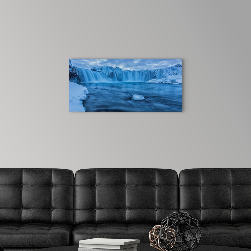 A modern room featuring The Waterfall Godafoss In Northern Iceland Seen In The Winter At Sunset; Iceland