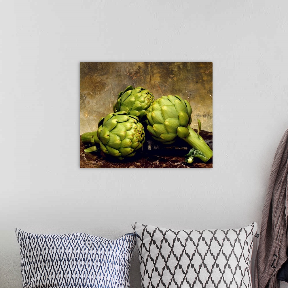 A bohemian room featuring Three artichokes on marble