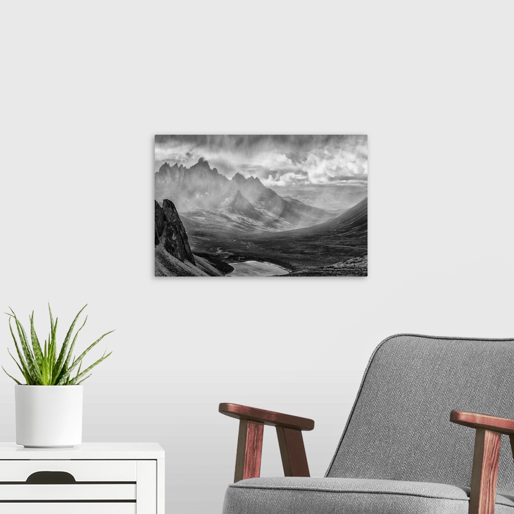 A modern room featuring Black and White image of a rain storm over the Tombstone Valley in Tombstone Territorial Park, wi...