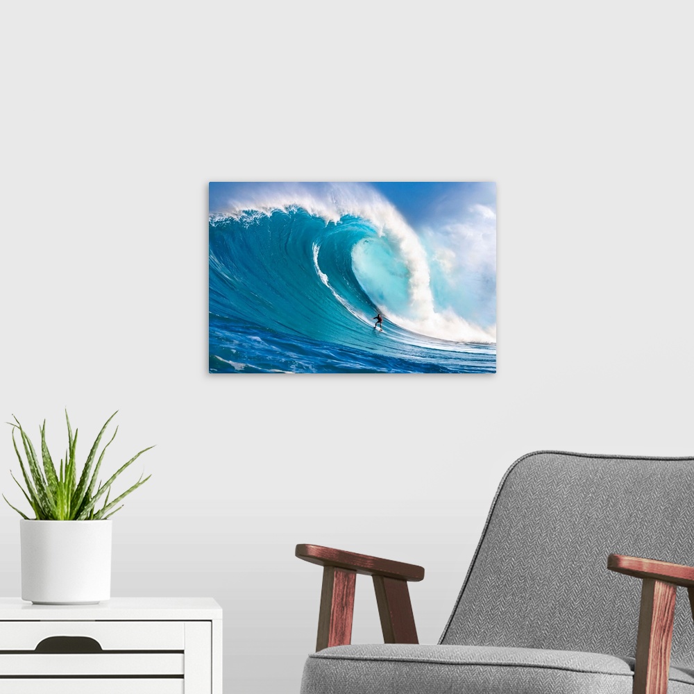 A modern room featuring A tow-in surfer drops down the face of Hawaii's big surf at Peahi (Jaws) off North shore Maui; Ma...