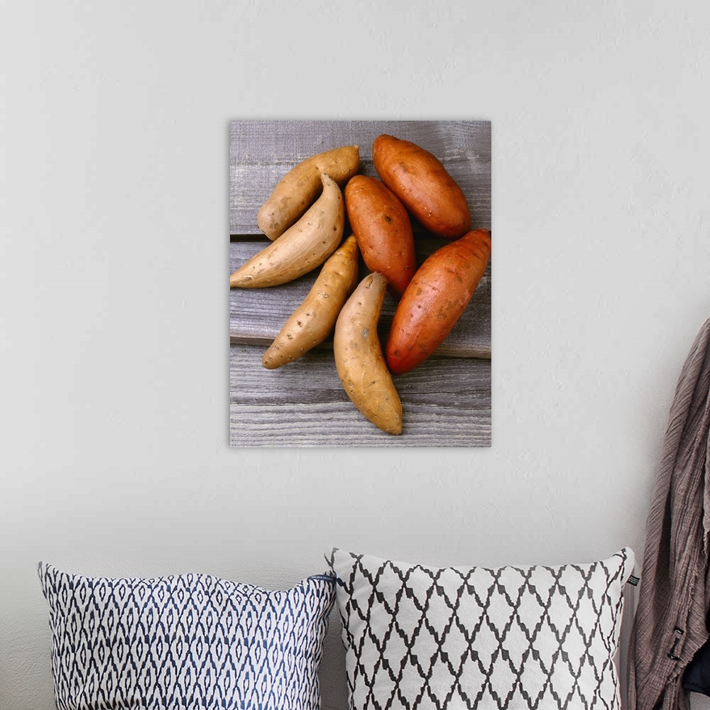 A bohemian room featuring Traditional sweet potatoes on the left and yams on the right
