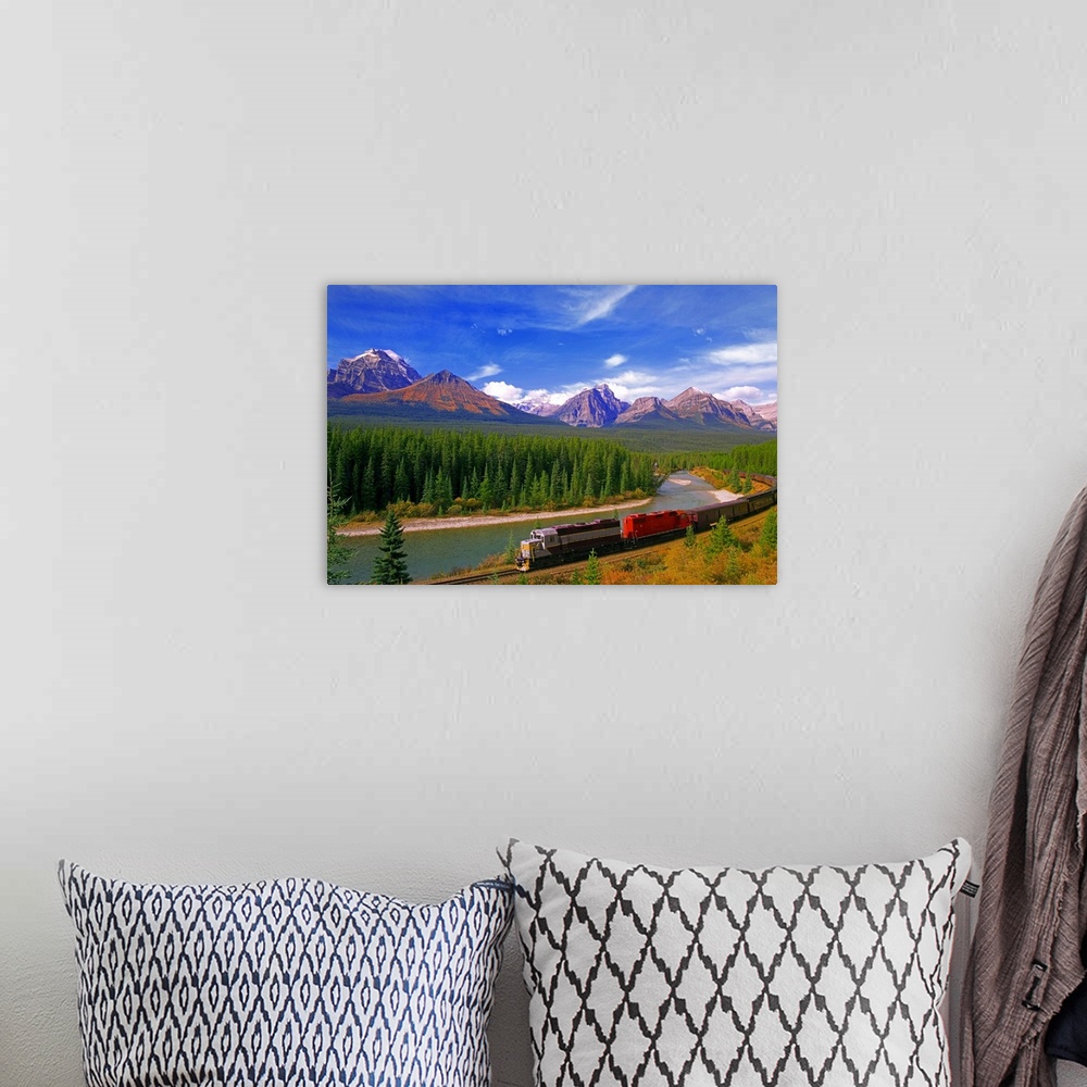 A bohemian room featuring Big canvas photo art of a train running through the Canadian countryside with forests surrounding...