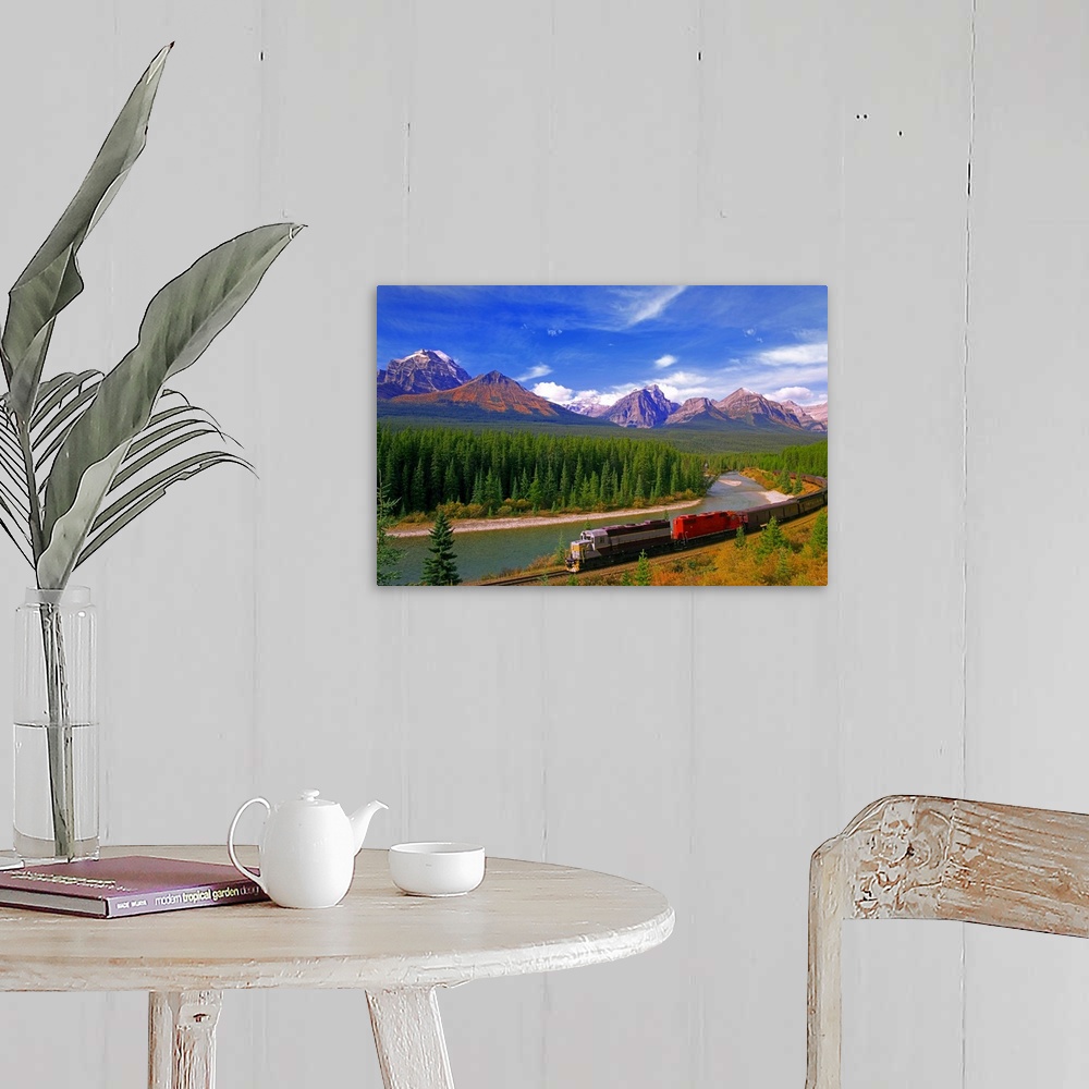 A farmhouse room featuring Big canvas photo art of a train running through the Canadian countryside with forests surrounding...