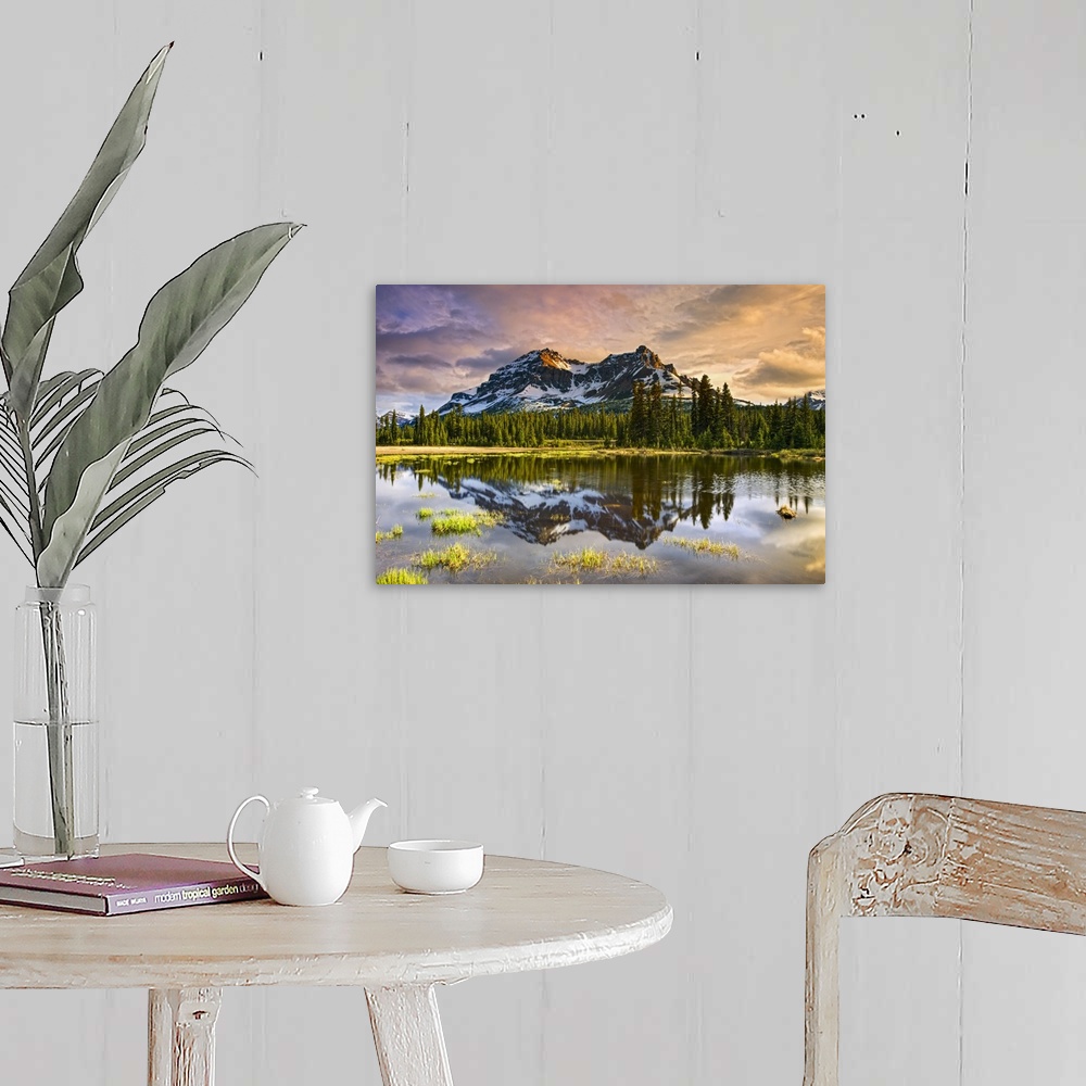 A farmhouse room featuring A tranquil lake reflecting the mirror image of a forest and rugged mountains, Banff National Park...