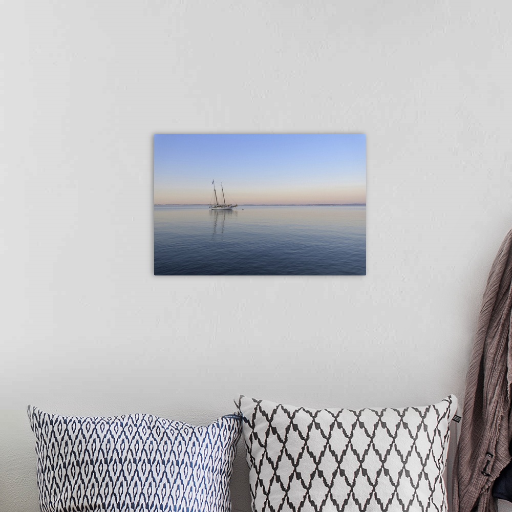 A bohemian room featuring Two masted sailboat anchored on Lake Garda (Lago di Garda) at dawn at Bardolinoin Veneto, Italy