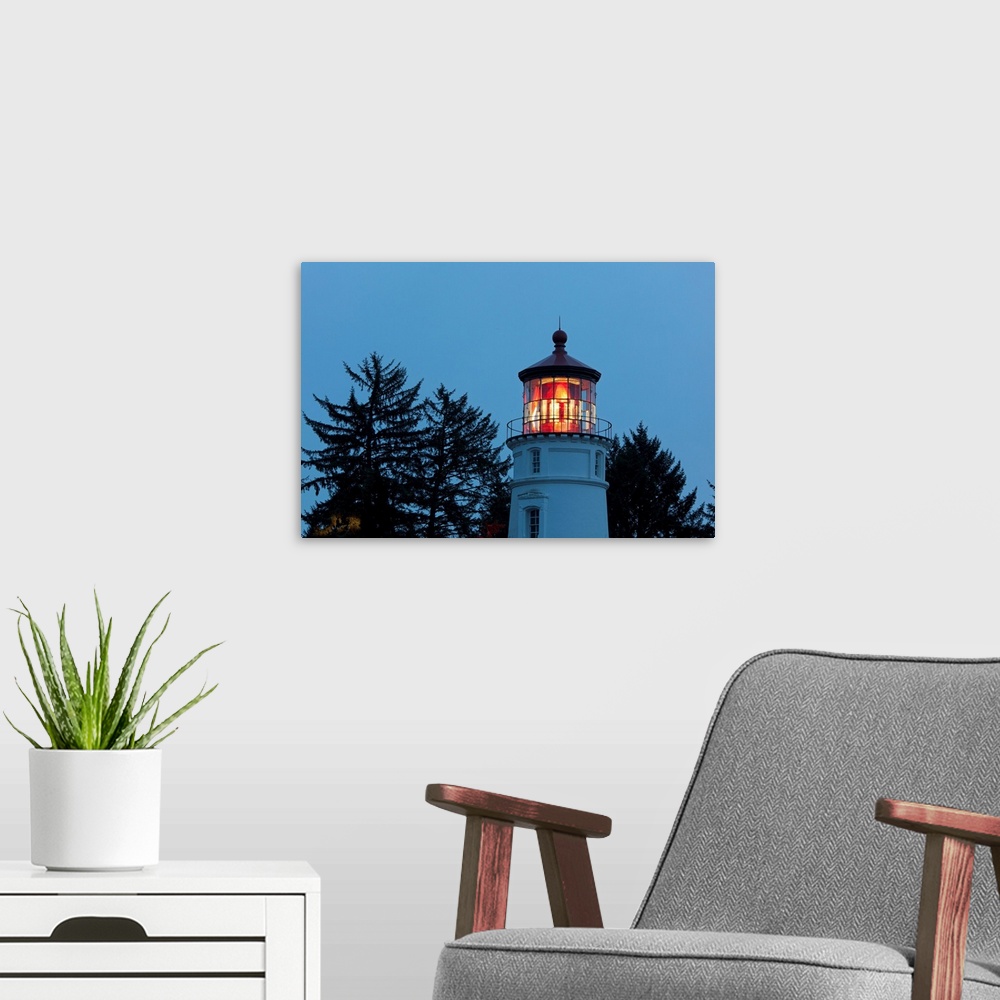A modern room featuring Umpqua river lighthouse at twilight on the Oregon coast in the pacific northwest, Oregon, united ...