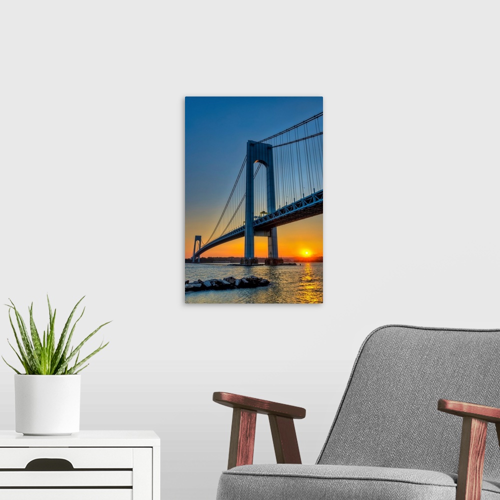 A modern room featuring Verrazano-Narrows Bridge at sunset;  Brooklyn, New York, United States of America