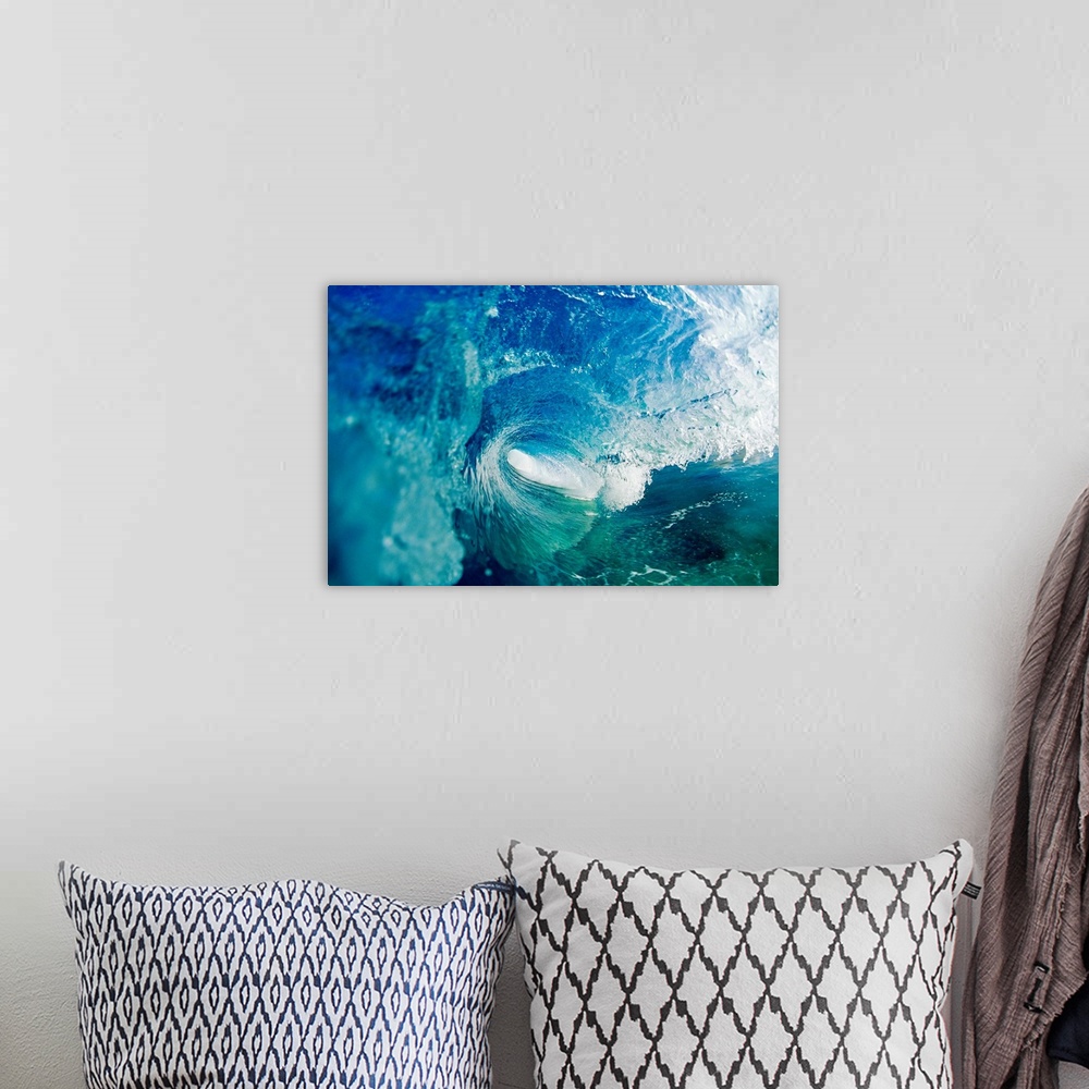 A bohemian room featuring Big photo on canvas of a wave rolling and about to crash in the ocean.