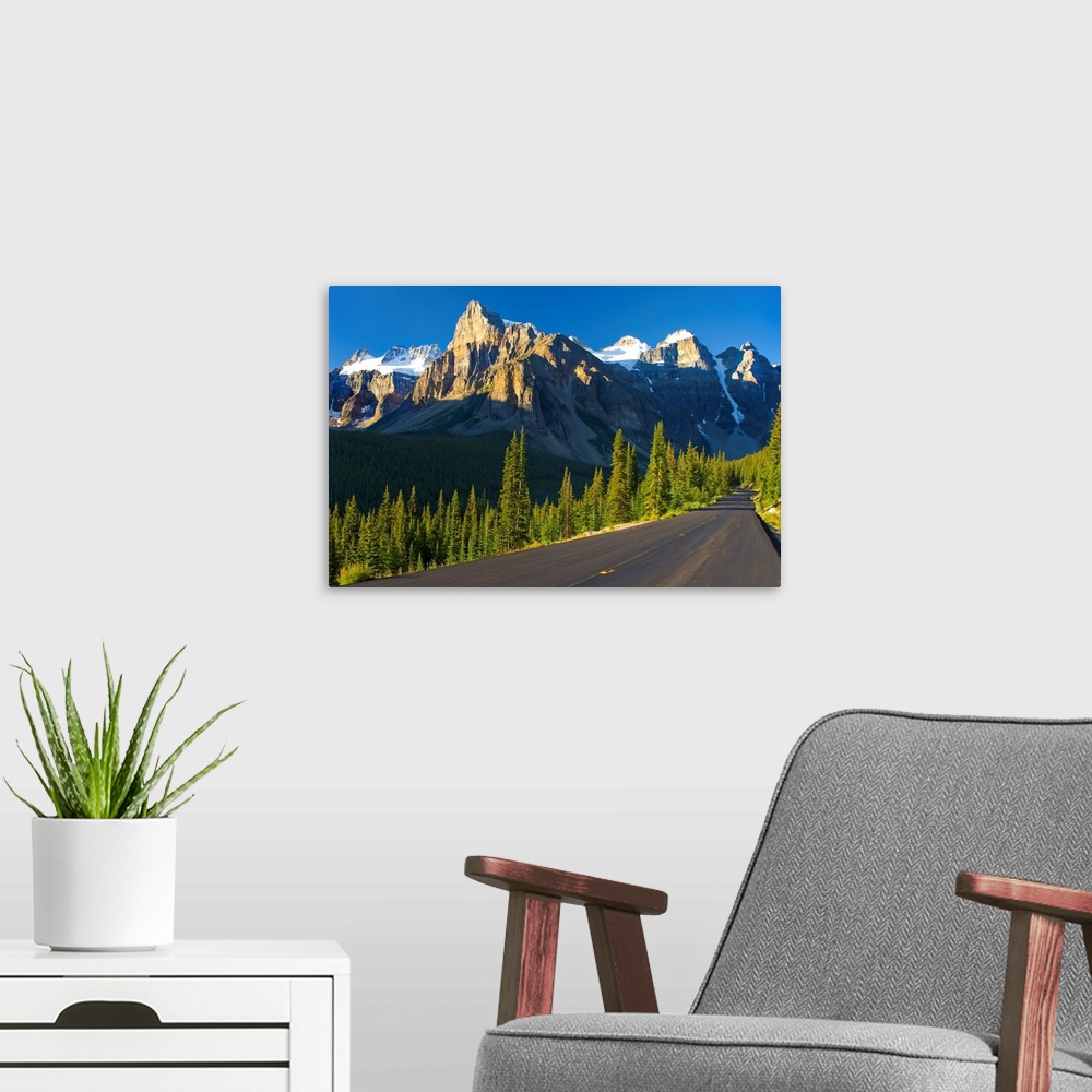 A modern room featuring View Of Glacial Mountains And Trees Along The Road; Alberta Canada