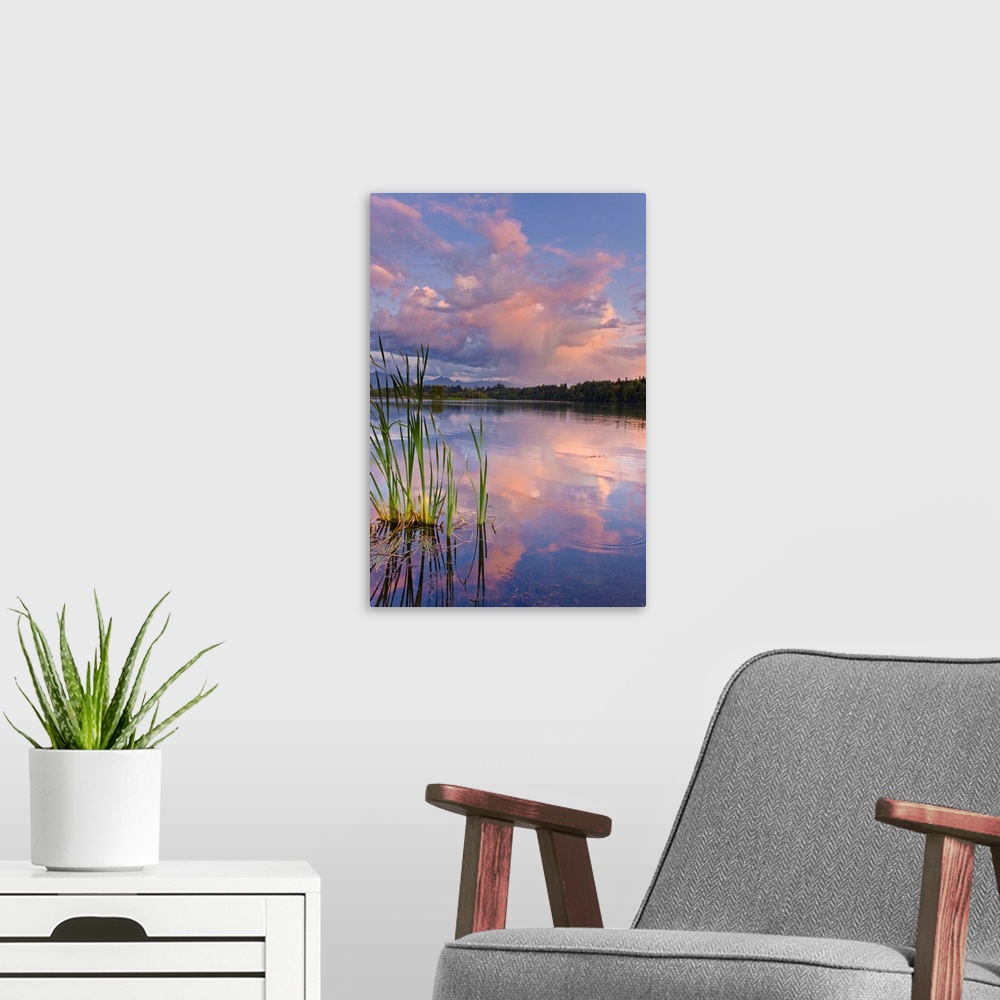 A modern room featuring View of sunset clouds reflected in  Westchester Lagoon near downtown Anchorage
