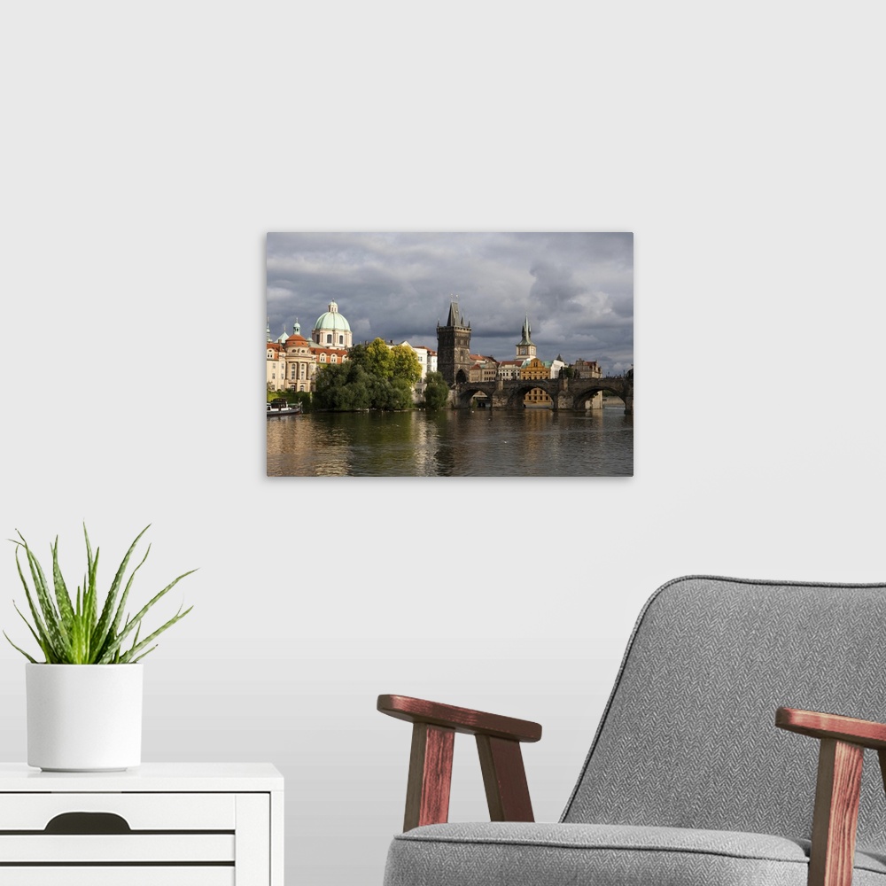 A modern room featuring From the Vltava River, a view of the Charles Bridge and The Old Town in Prague. Prague, Czech Rep...