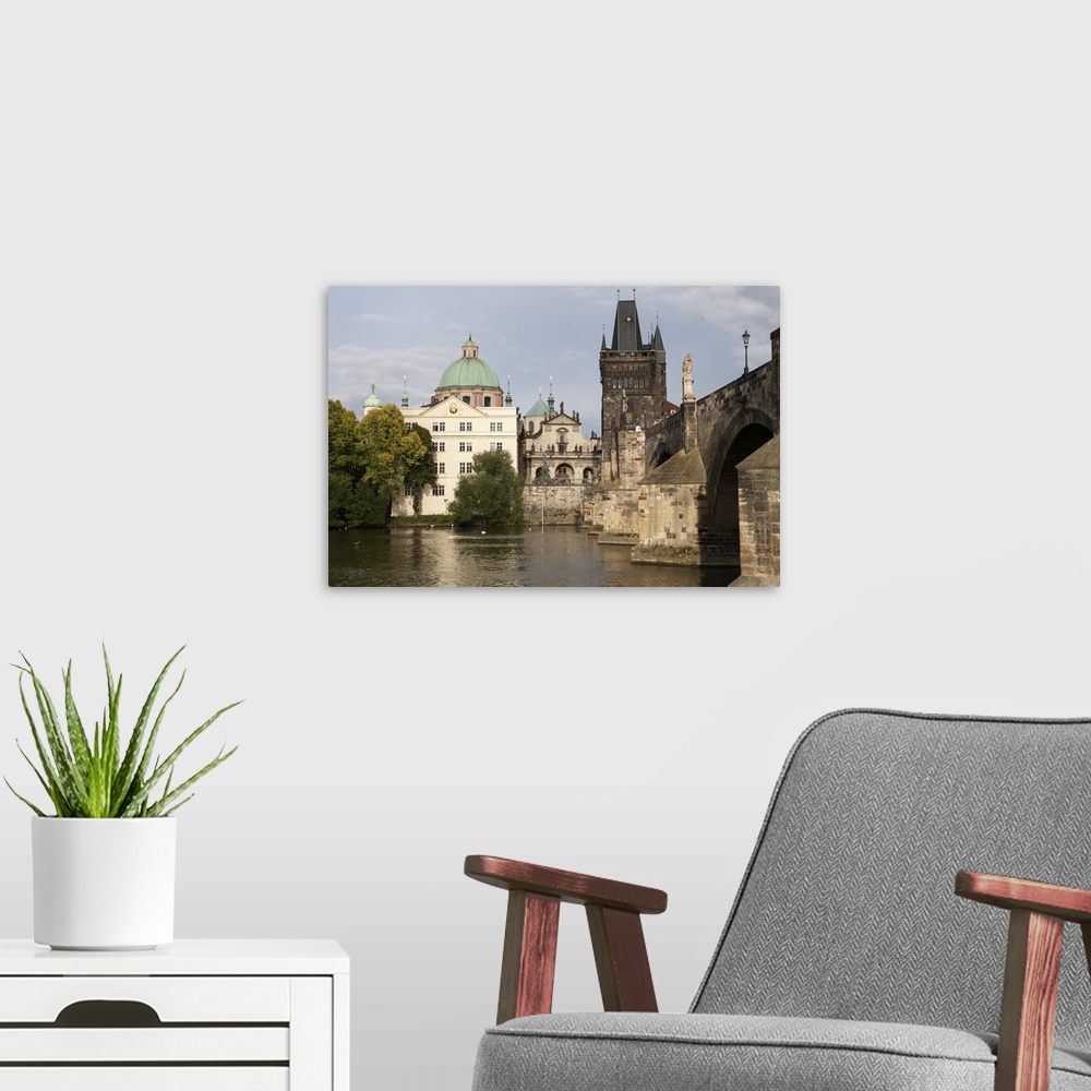 A modern room featuring From the Vltava River, a view of the Charles Bridge and The Old Town in Prague. Prague, Czech Rep...