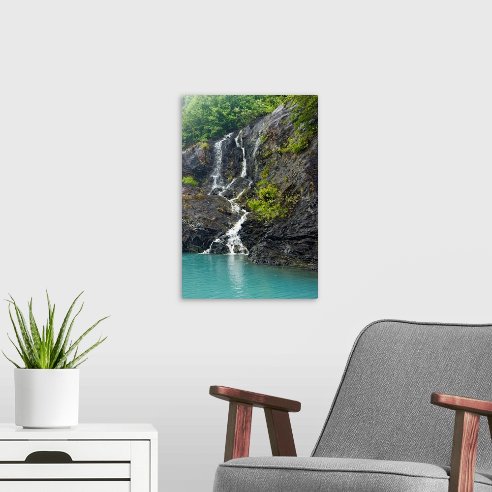 A modern room featuring Waterfall cascading down the rocks of the Passage Canal in Whittier, Alaska.