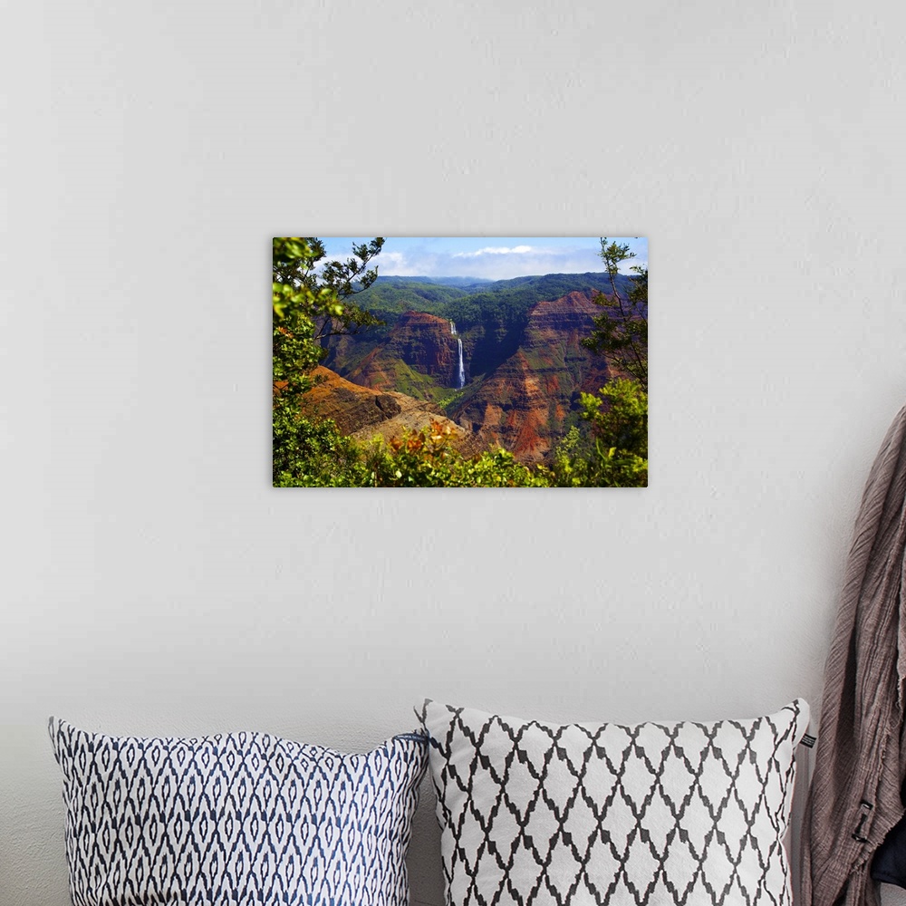 A bohemian room featuring Waimea Canyon Falls and lush foliage on rugged cliffs and mountains; Waimea, Kauai, Hawaii, Unite...