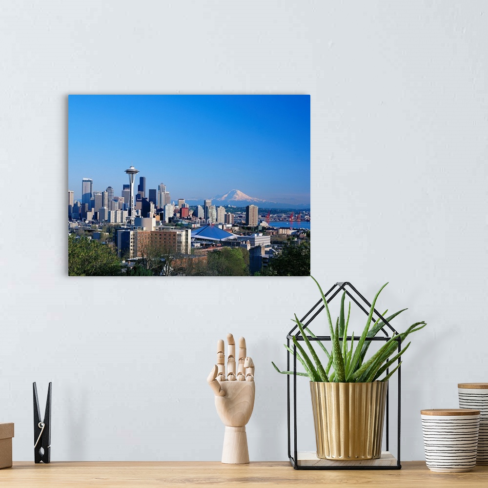A bohemian room featuring Washington, Seattle Skyline With Space Needle And Mount Hood In Background