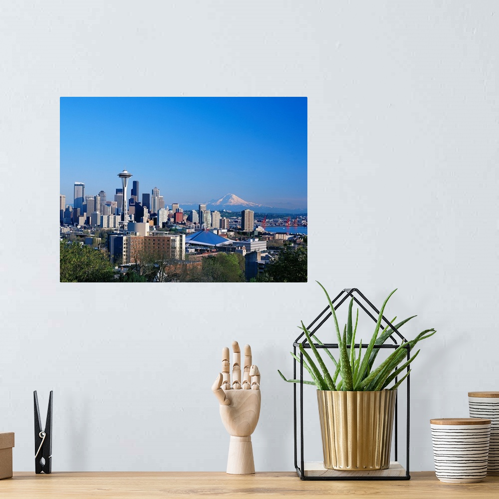 A bohemian room featuring Washington, Seattle Skyline With Space Needle And Mount Hood In Background
