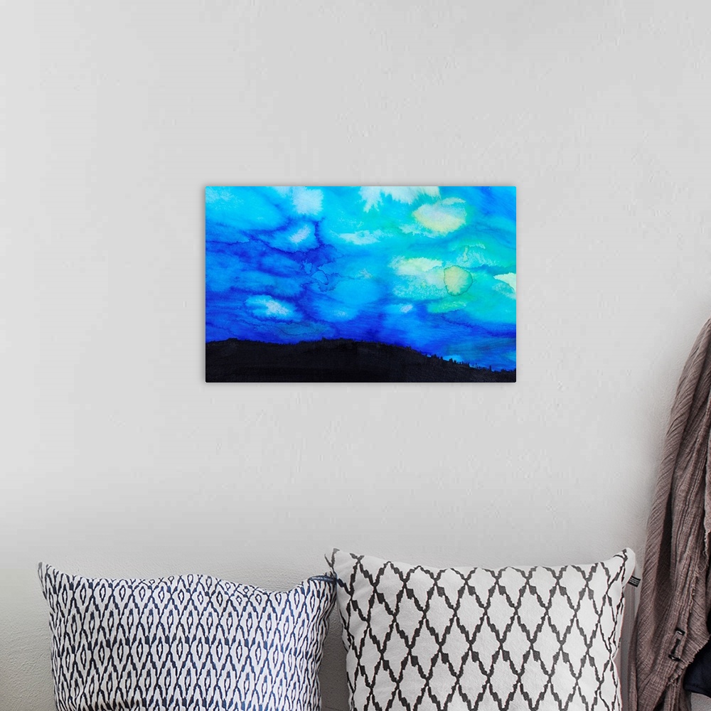 A bohemian room featuring Watercolor painting of a dramatic sky with blue clouds and silhouette of a landscape