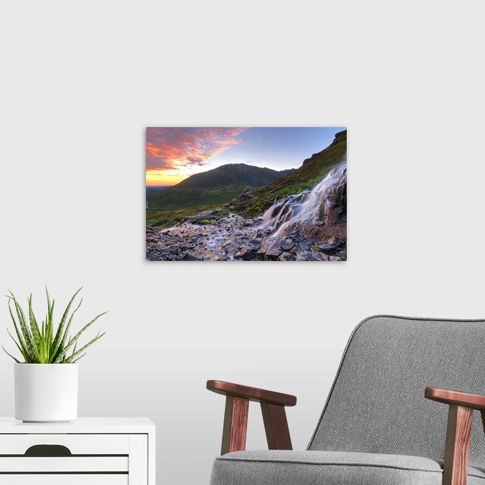 A modern room featuring Scenic sunset view of a waterfall at Summit Lake State Recreation Site, Hatcher Pass, Alaska.