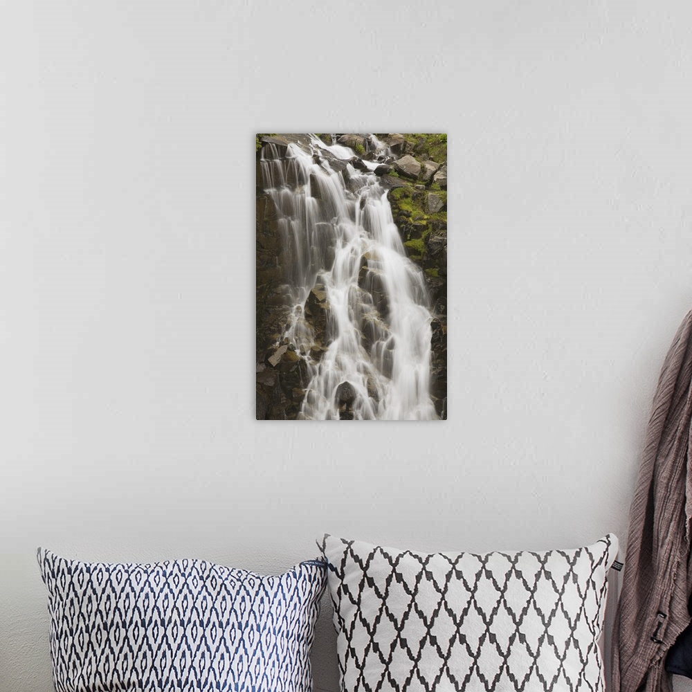 A bohemian room featuring Waterfall Flowing Over Rocks; Washington