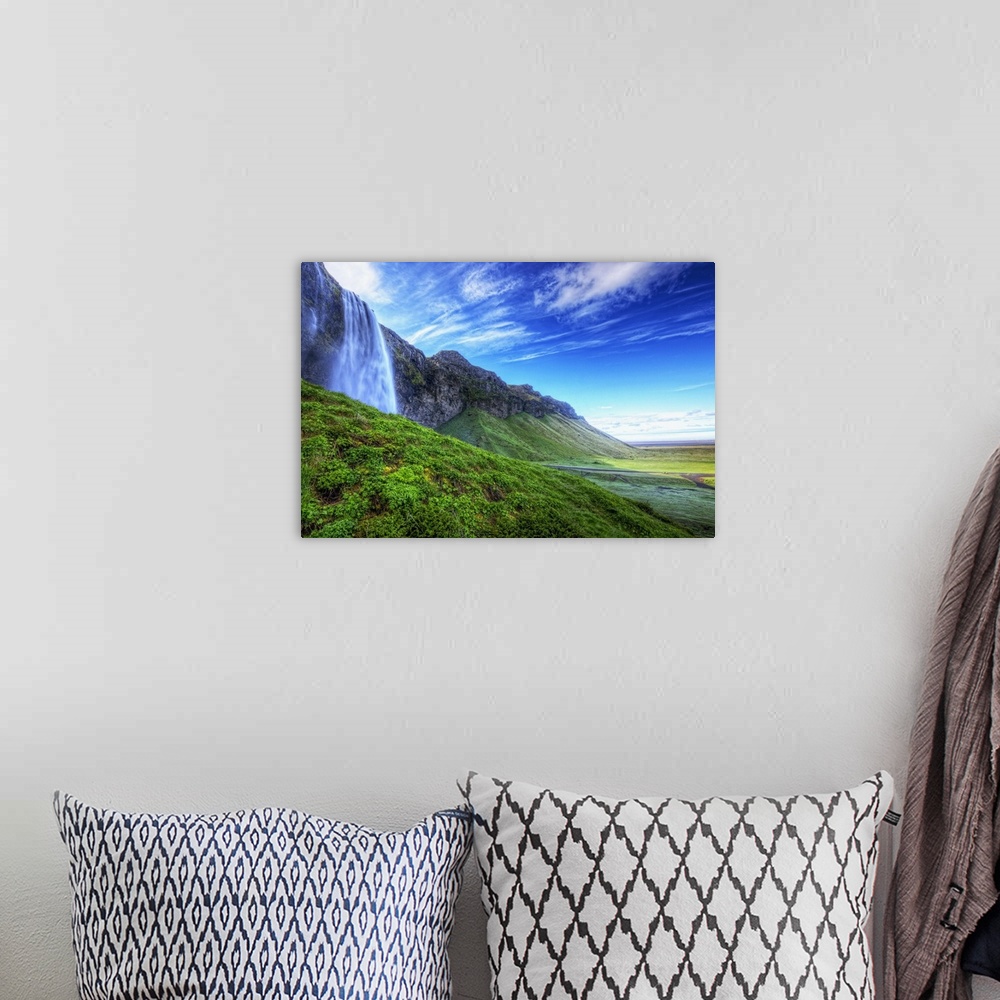 A bohemian room featuring HDR of waterfall Seljalandsfoss along the southern coast of Iceland; Iceland