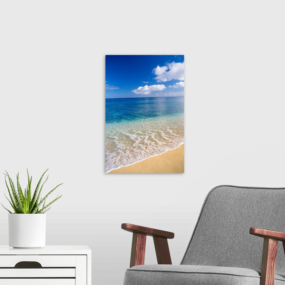 A modern room featuring Wave Washes Ashore Onto Sandy Beach, Azure Ocean, Blue Sky
