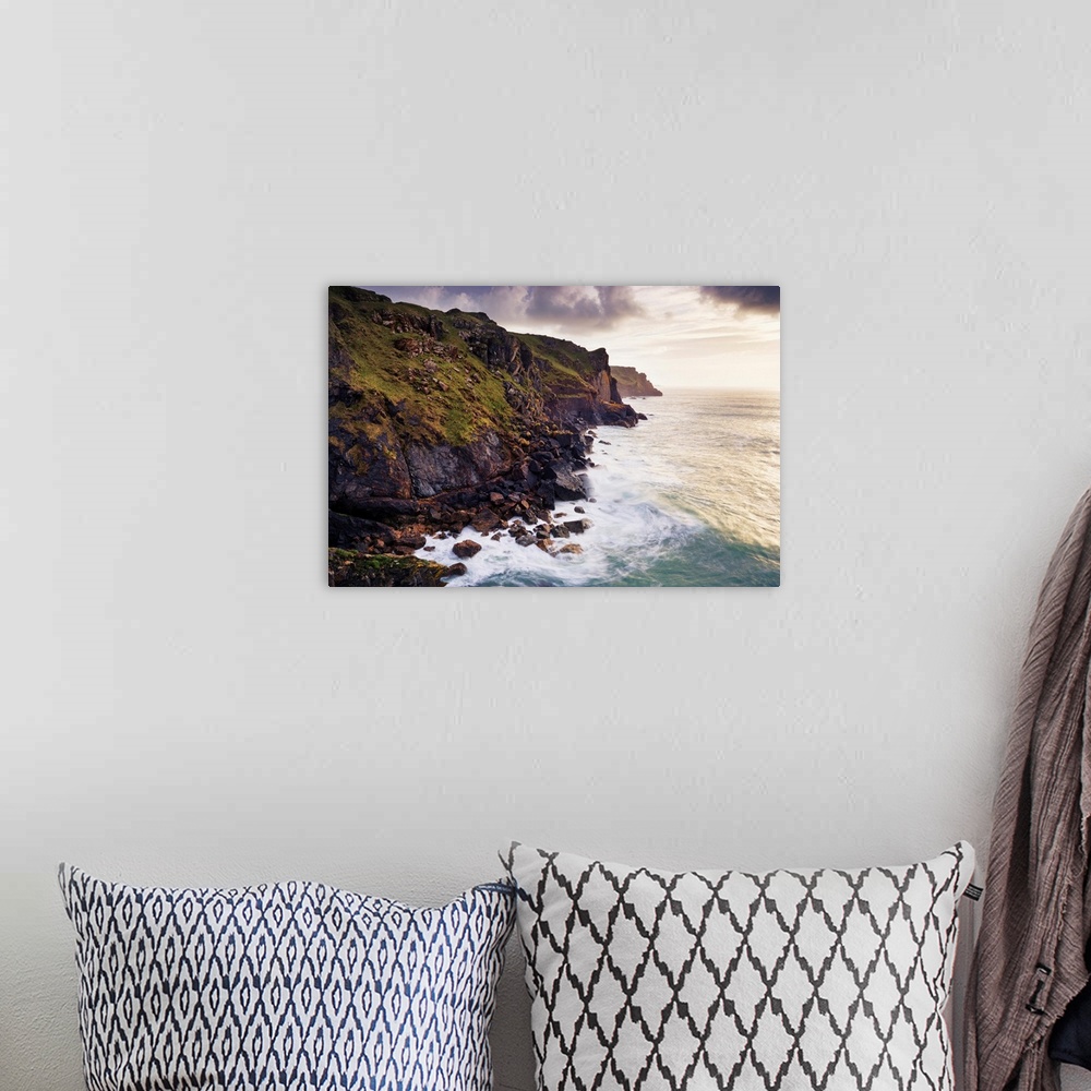 A bohemian room featuring Waves Breaking below Rugged Sea Cliffs, Rumps Point, Cornwall, England