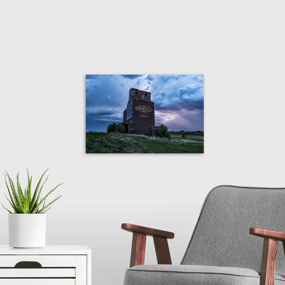 A modern room featuring Weathered grain elevator and electrical storm on the prairies; Saskatchewan, Canada