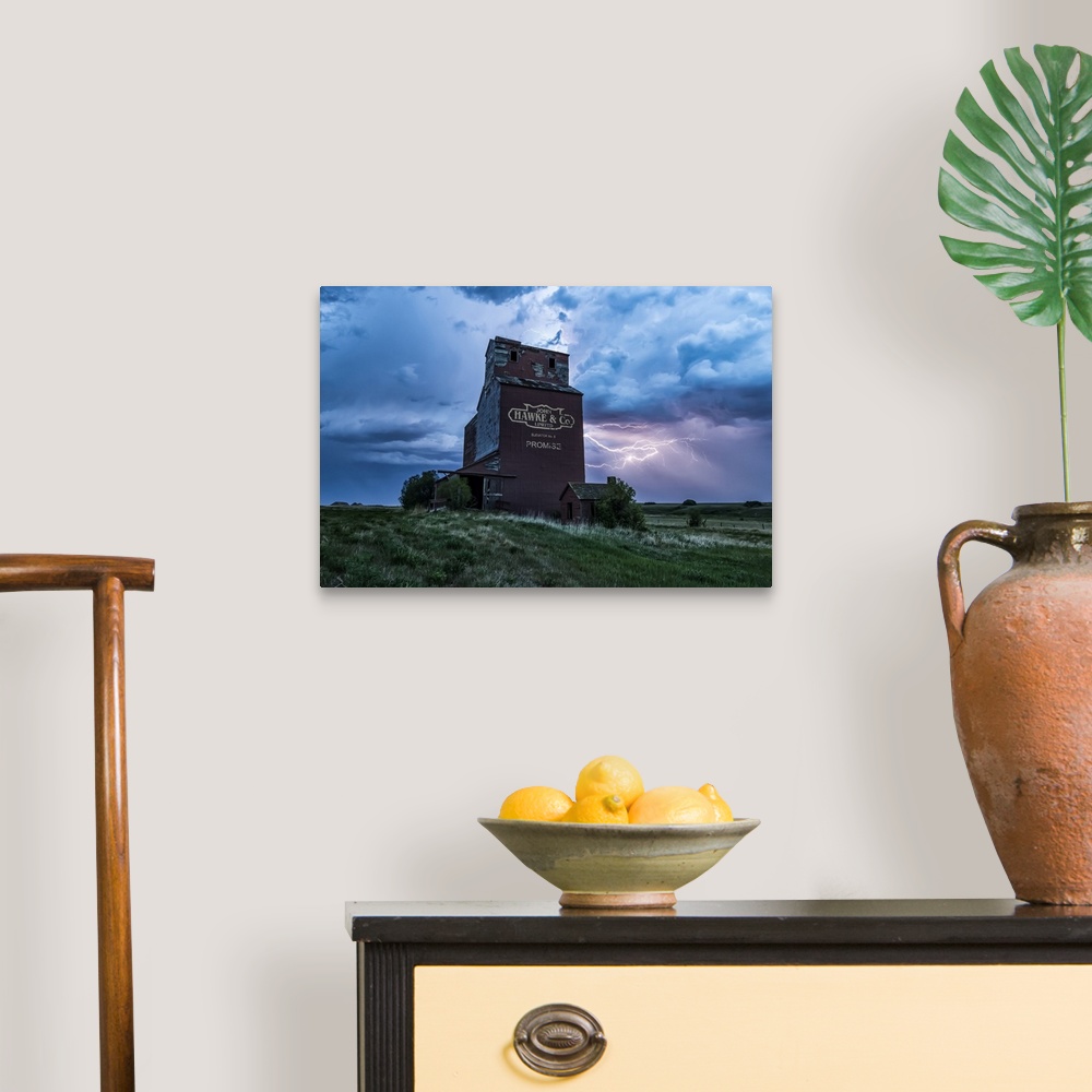A traditional room featuring Weathered grain elevator and electrical storm on the prairies; Saskatchewan, Canada