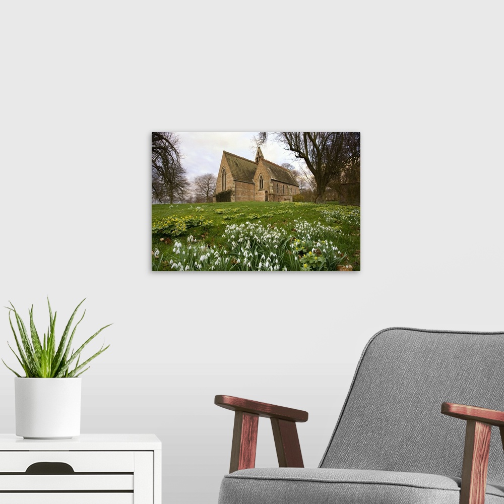 A modern room featuring White Flowers With A Small Church In Background, Northumberland, England