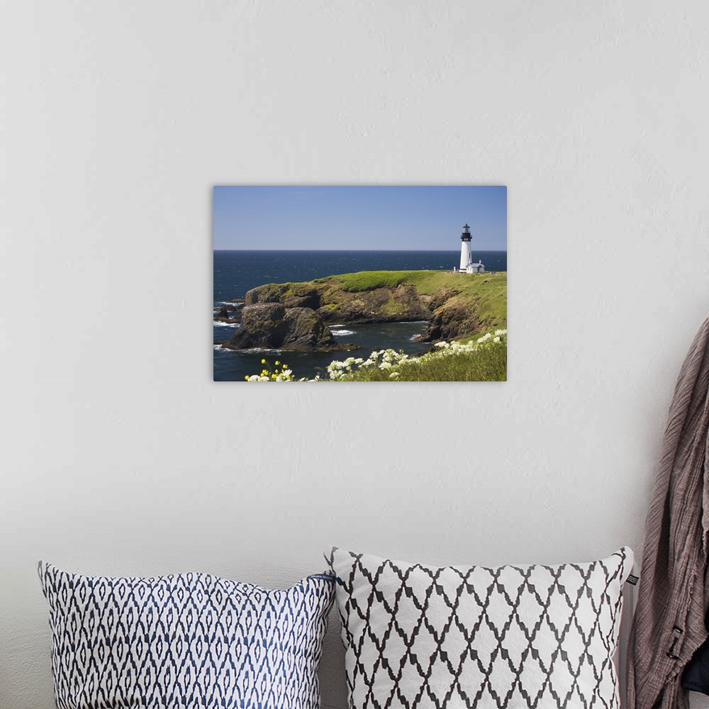 A bohemian room featuring White Lighthouse On The Ocean With Wildflowers; Newport, Oregon, USA