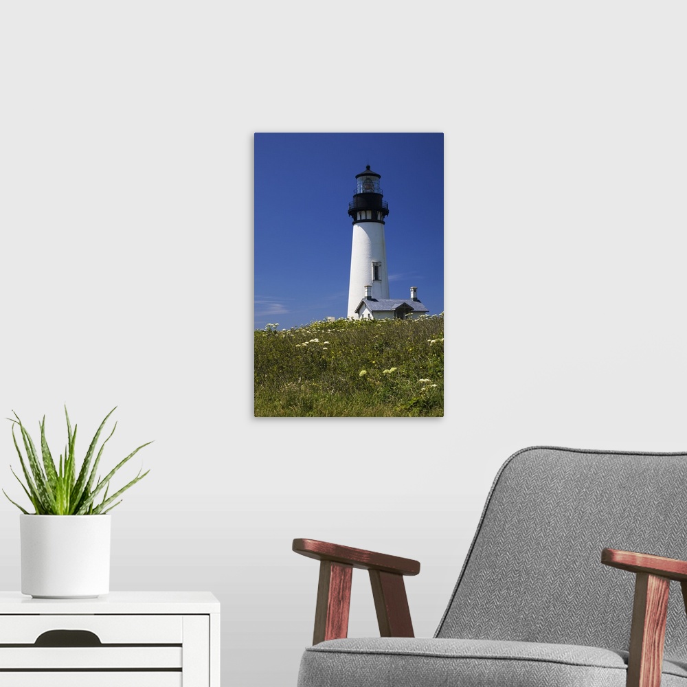 A modern room featuring White Lighthouse With A Blue Sky And Wildflowers; Newport, Oregon, USA
