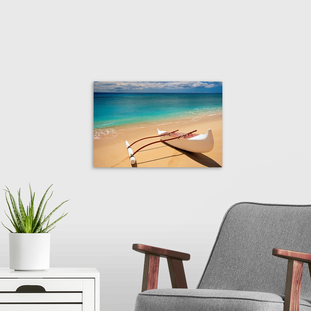 A modern room featuring Horizontal canvas of a canoe sitting on a beach with crystal clear water washing ashore from the ...