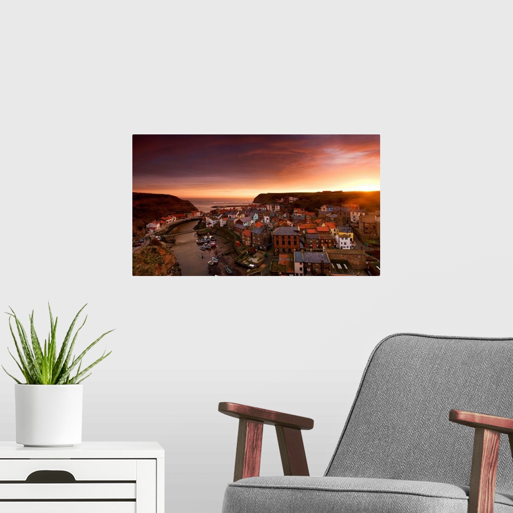 A modern room featuring Wide Angle Cityscape At Sunset, Staithes, Yorkshire, England
