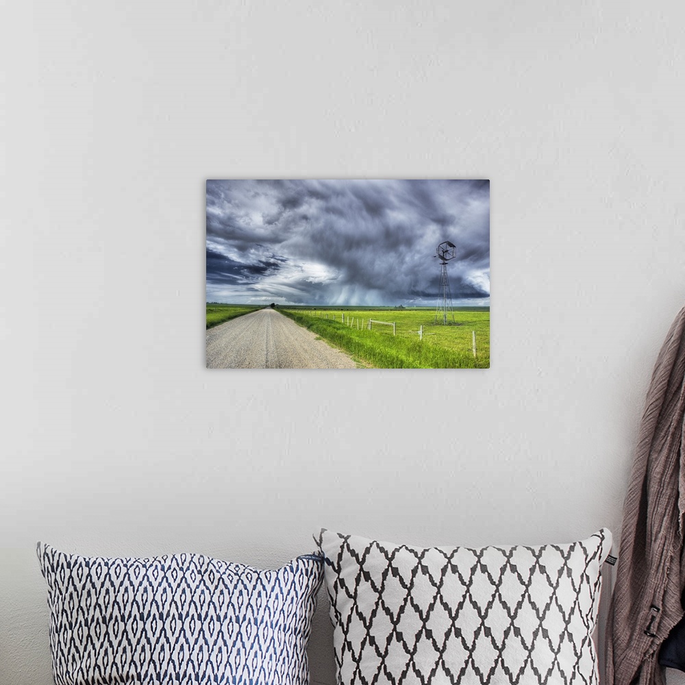 A bohemian room featuring Windmill And Country Road With Storm Clouds Near Carstairs, Alberta