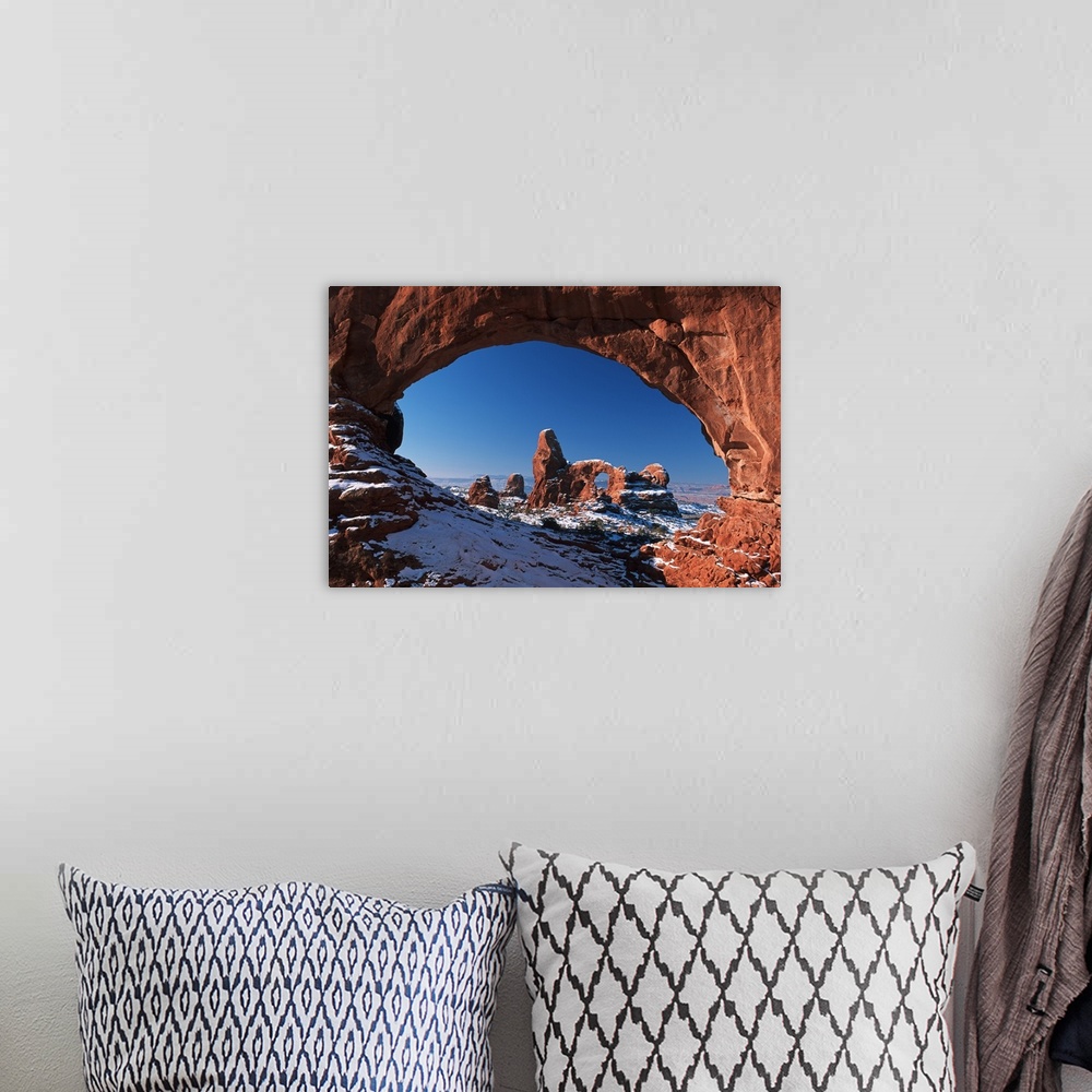 A bohemian room featuring Winter Snow Covers Turret Arch At Arches National Park; Utah