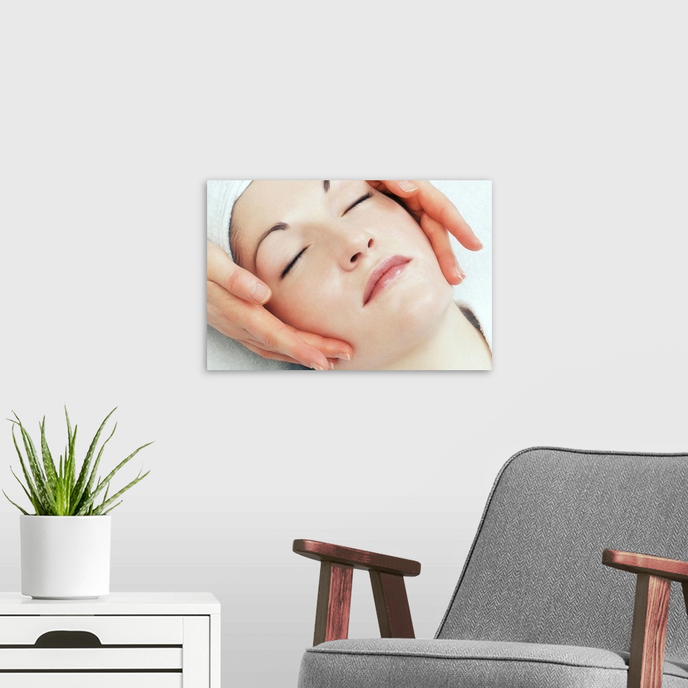 A modern room featuring Woman Getting A Face Massage