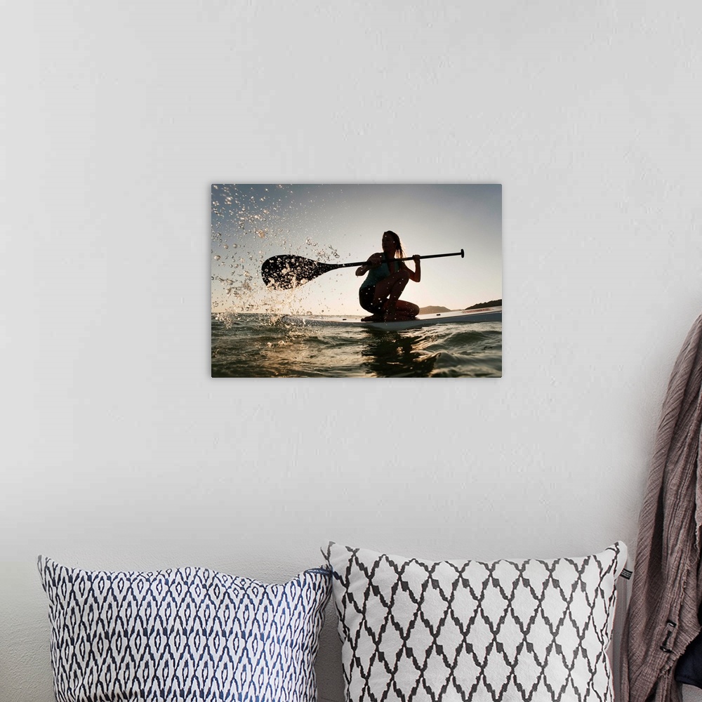 A bohemian room featuring Woman Paddling While On Her Knees On Surf Board, Tarifa, Andalusia, Spain