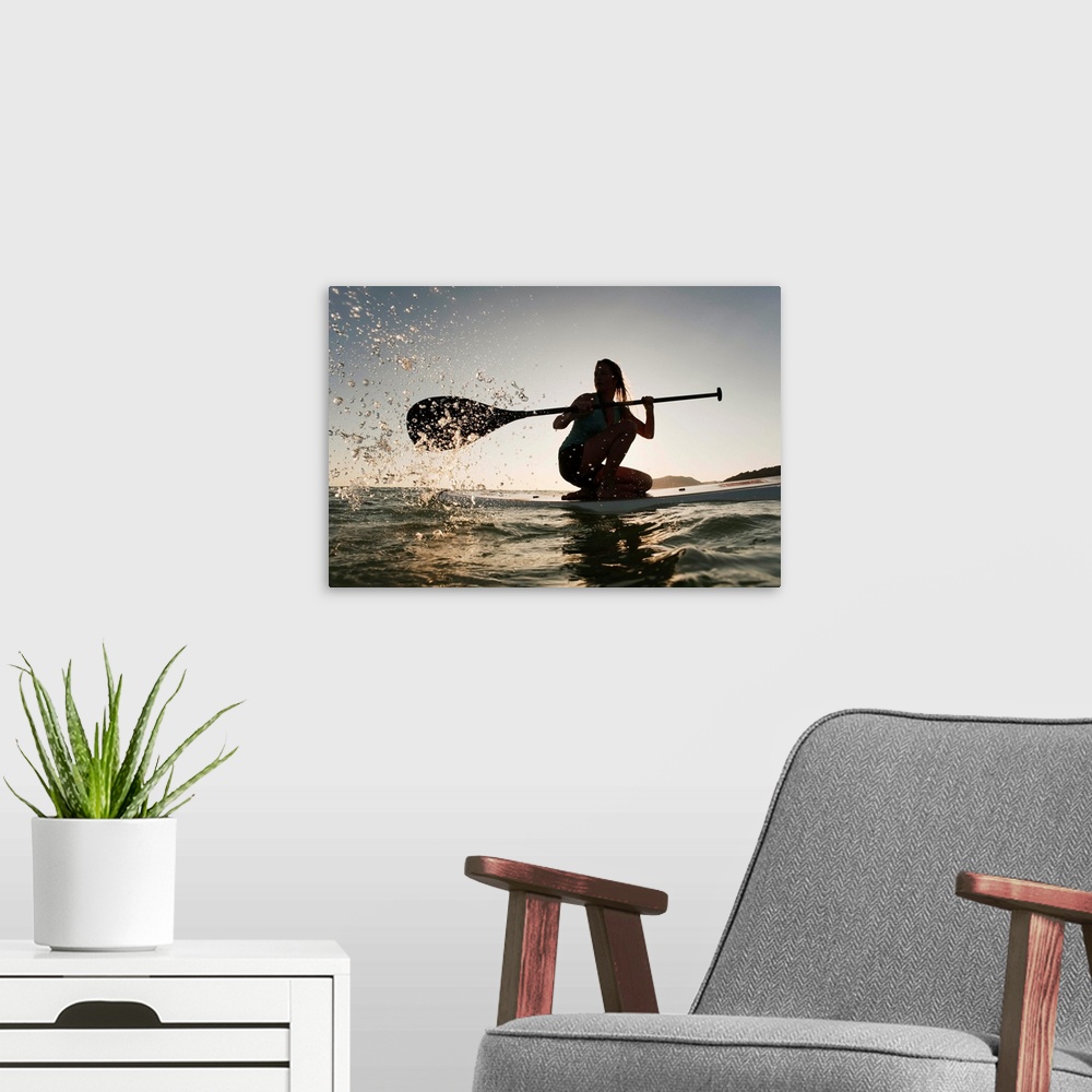 A modern room featuring Woman Paddling While On Her Knees On Surf Board, Tarifa, Andalusia, Spain