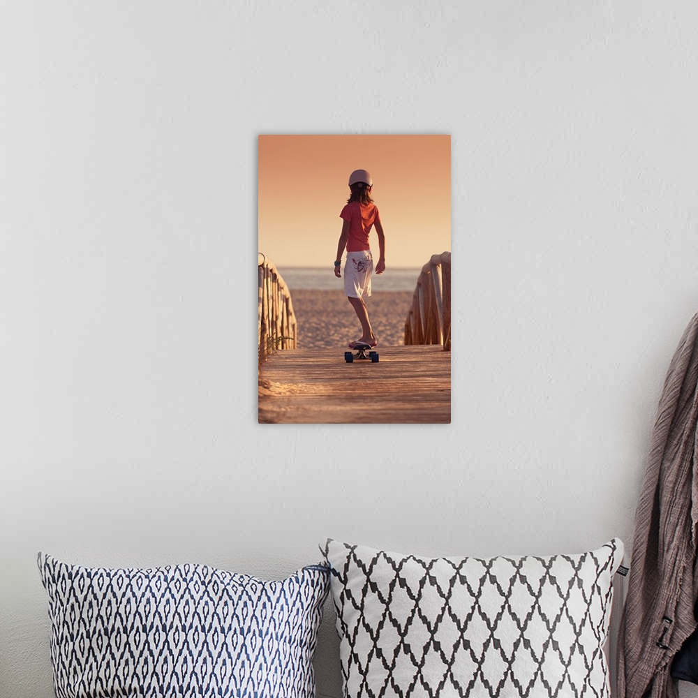 A bohemian room featuring Young Person Skateboarding On A Wooden Boardwalk Towards Beach, Andalusia, Spain
